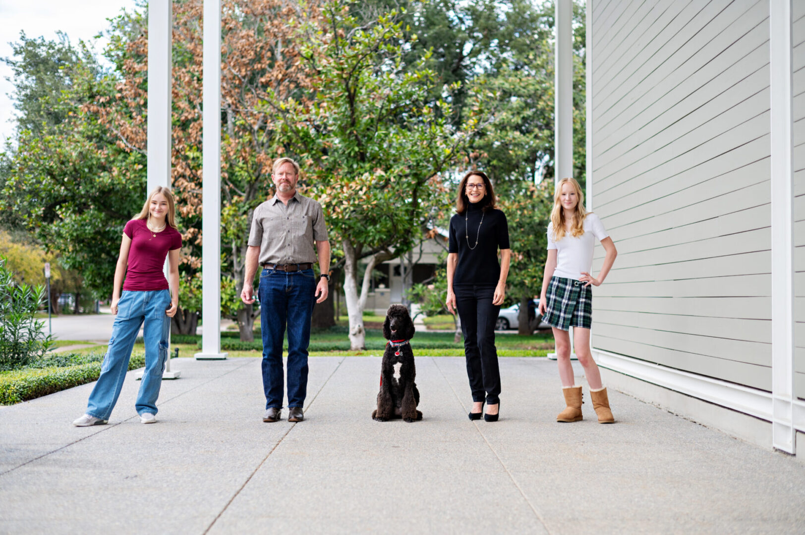 Group standing with dog outdoors