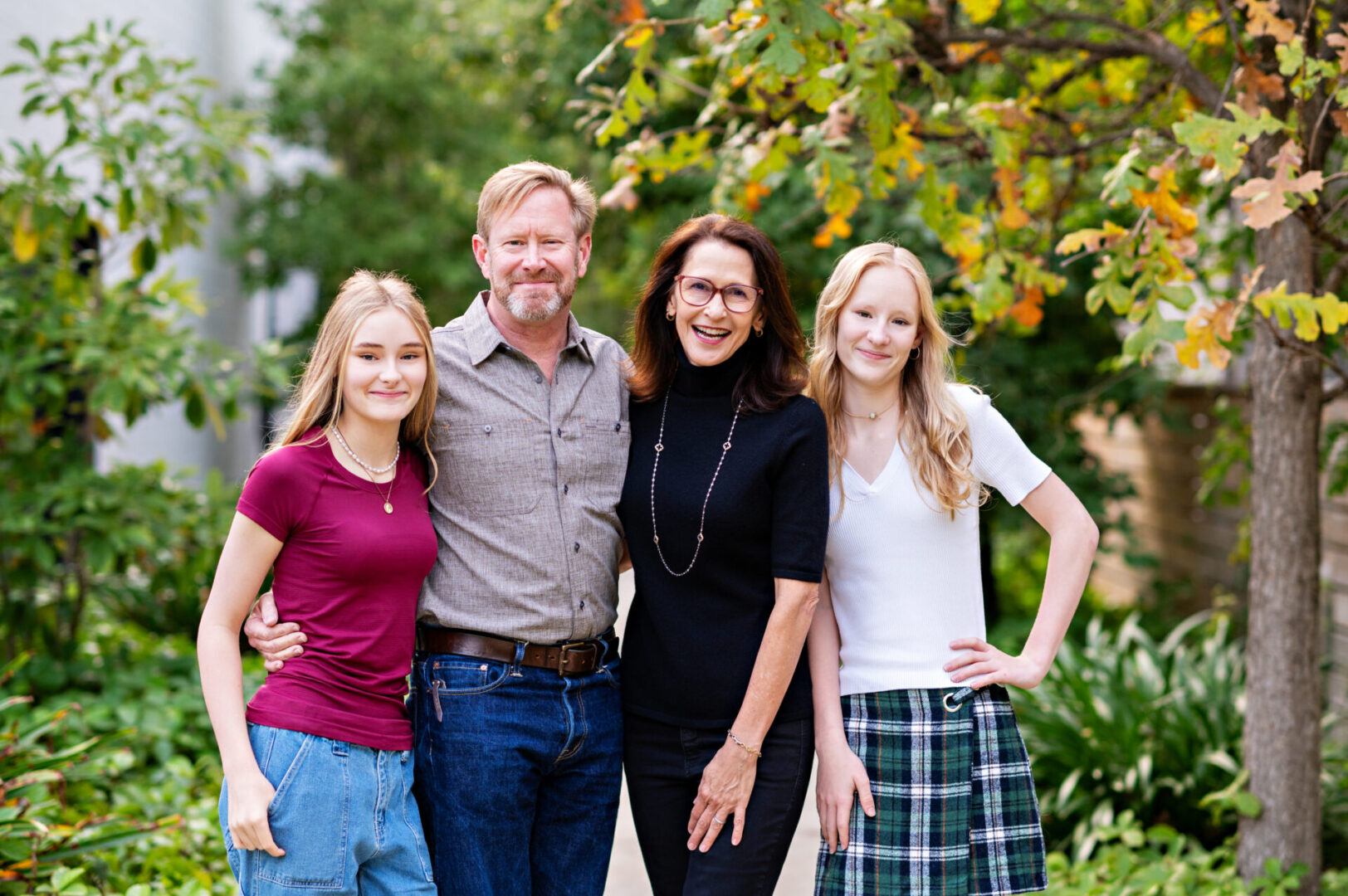 Parents with two daughters outside