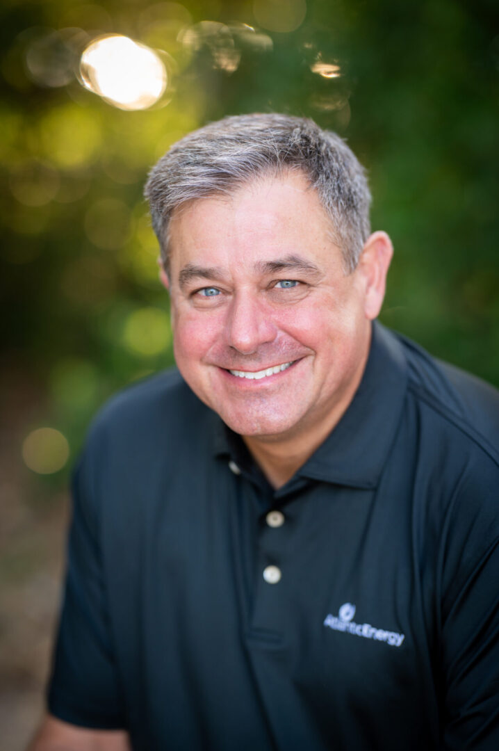 Happy person enjoying nature, wearing polo.