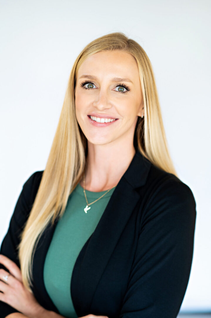 Confident woman posing with arms crossed