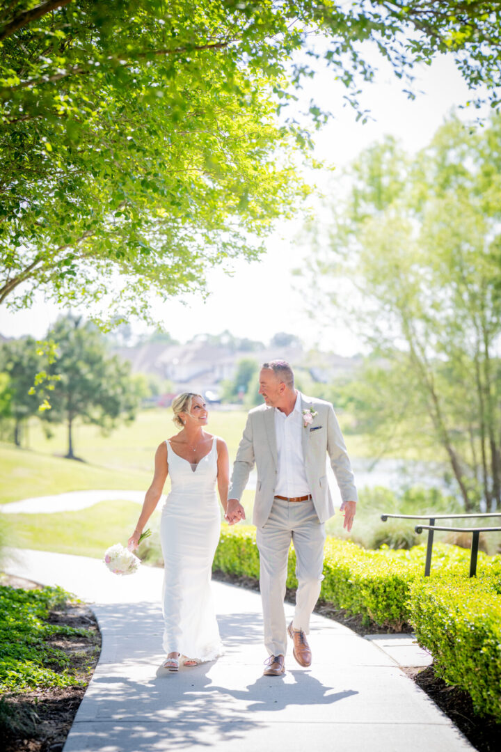 Bride and groom walking outdoors