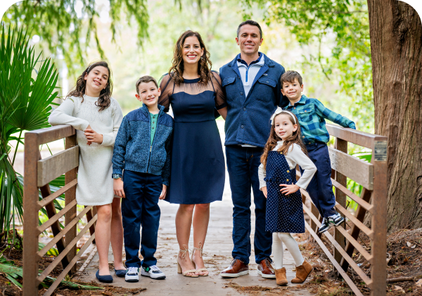 Smiling family in outdoor setting